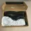 Thumbnail: Top view of the shoes with 1 wrapped in tissue in the open box
