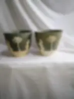 Front view of 2 x Vintage Dialene Jasper style plant pots