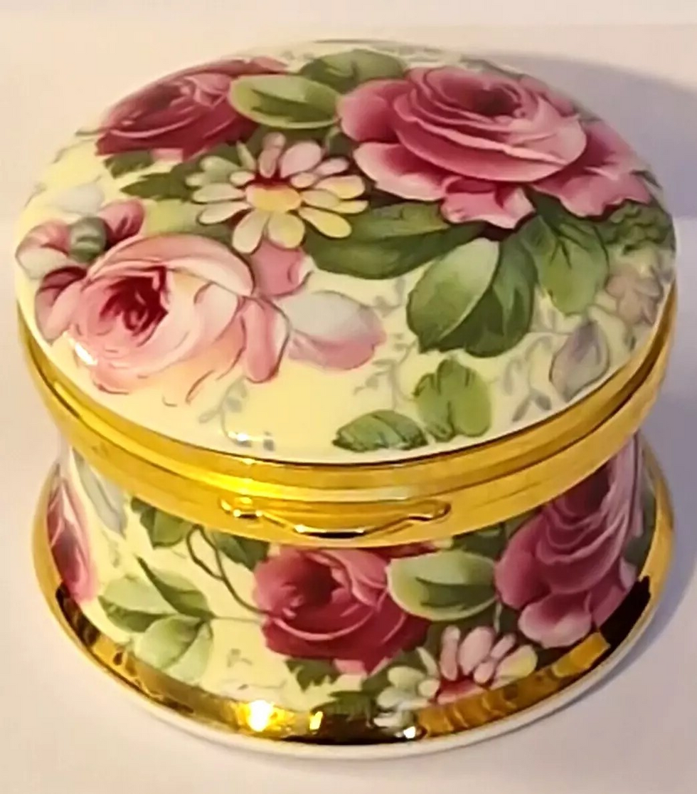 Angled top and front view of the Small Falcon China Hand Crafted Hinged Lid Pill Box, White with Pink Flowers