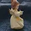 Thumbnail: Right side view of the Vintage German Porcelain Figurine Birthday Yellow and White July Angel