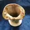 Thumbnail: Angled top front view of the Ceramic Cream Coloured Studio Art Vase with leaves on a vine design