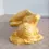 Thumbnail: Left side view of the Studio Art Of A Nude Woman Figure Lying Down in an orange glaze