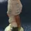Thumbnail: Left Rear view of the Vintage German Porcelain Figurine Young Boy Wearing A Flat Cap