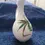 Thumbnail: Front view of the Italian Olive Oil Pitcher with a red onion design