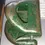 Thumbnail: Angled right side view of the Velos 1950s Green Metal Hole Puncher