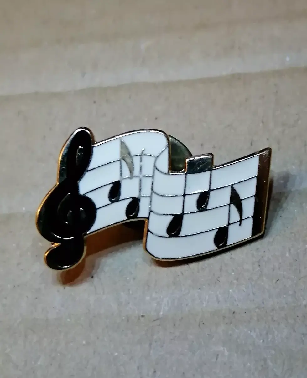 Front view of the Music Sheet Enamelled Gold Tone Pin Badge