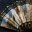 Thumbnail: Top left view of the open Beautiful Fabric Hand Fan Featuring Barcelona