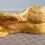 Thumbnail: Rear view of the Studio Art Of A Nude Woman Figure Lying Down in an orange glaze