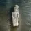 Thumbnail: Stylised front view of the Japanese Guisha Girl Figurine kneeling with a red flower in her hair