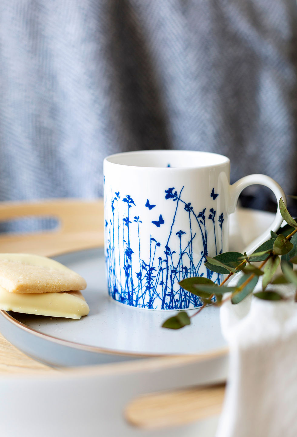 Thumbnail: Fine china butterfly mug, blue butterflies silhouetted over meadow