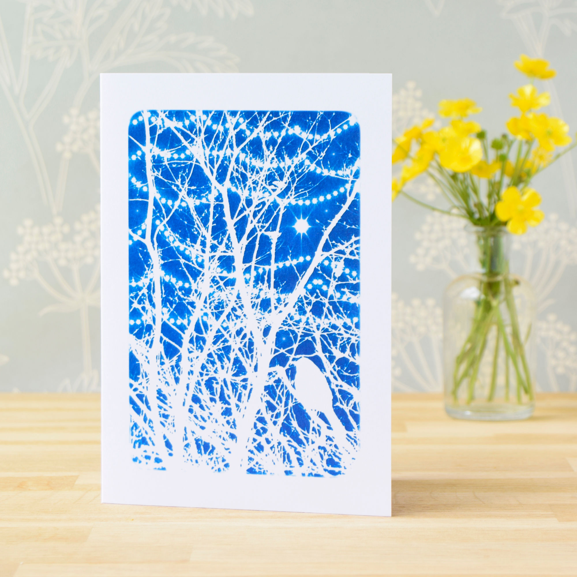 Bird in winter branches with twinkly lights card from Cyanotype art