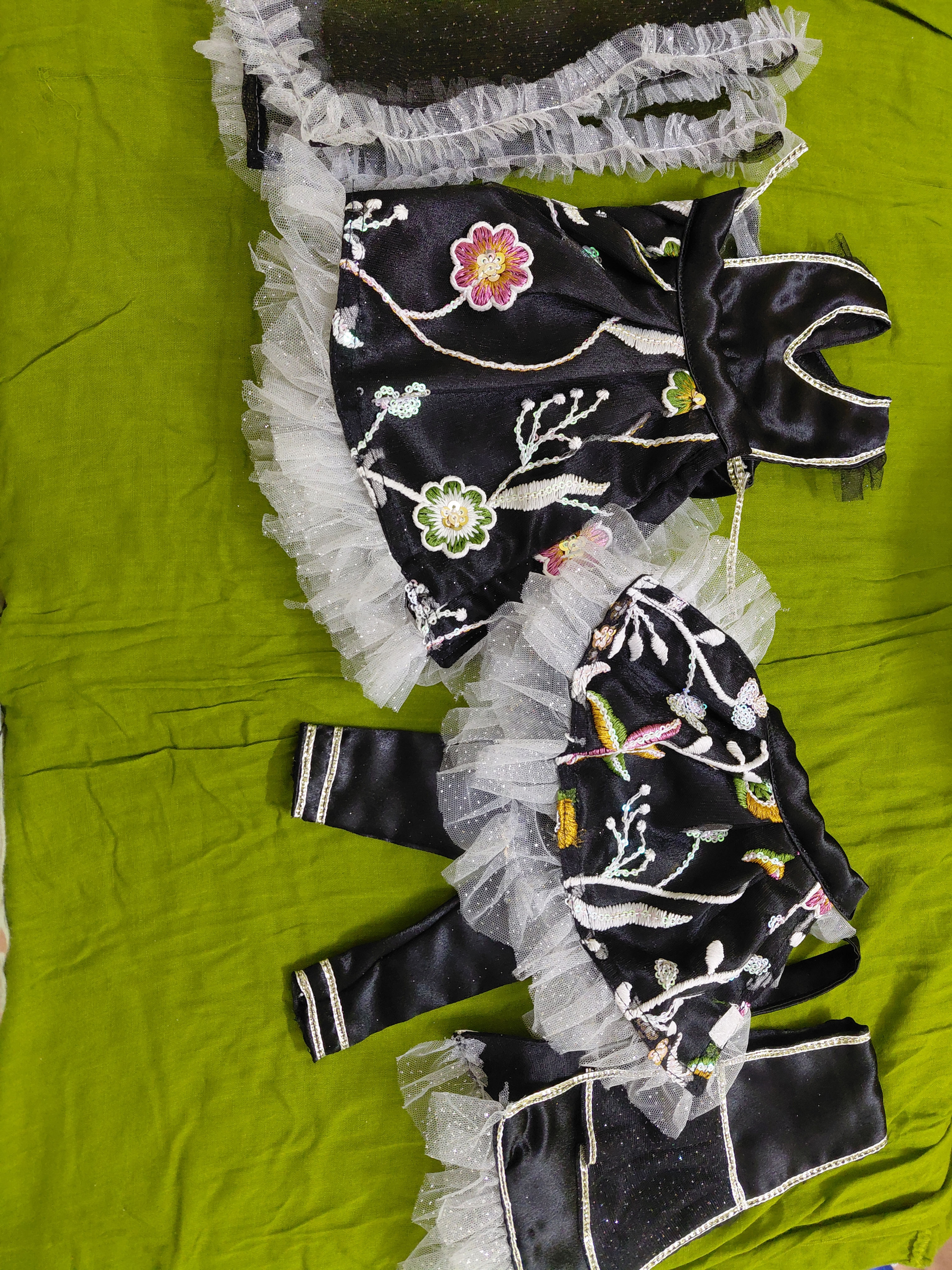 Radha Krishna: Black dress with white frill