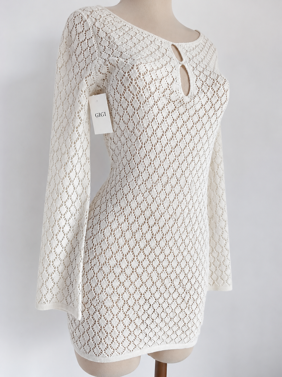 Miniatura: Vestido tejido de manga larga y unicolor, perfecto para vacaciones