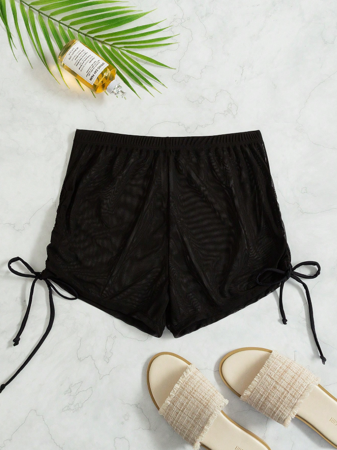 Miniatura: Short negro con transparencia, salida de playa