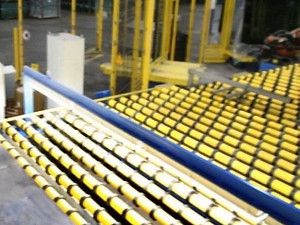 Yellow safety railings and industrial equipment in a factory setting
