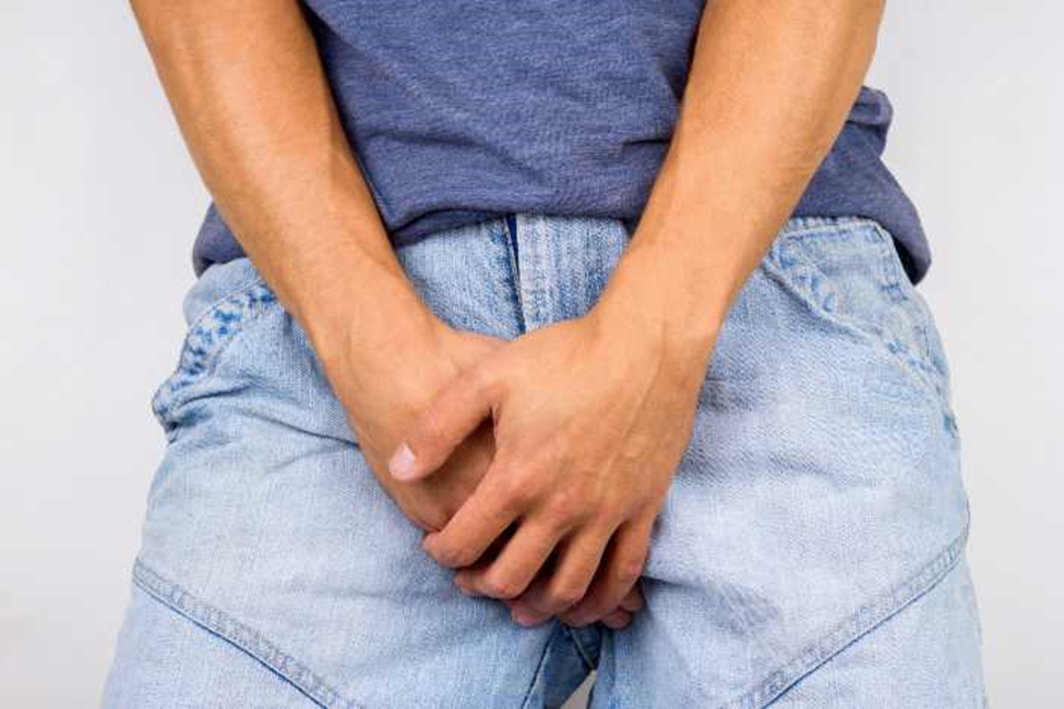 Male holding crotch jock itch