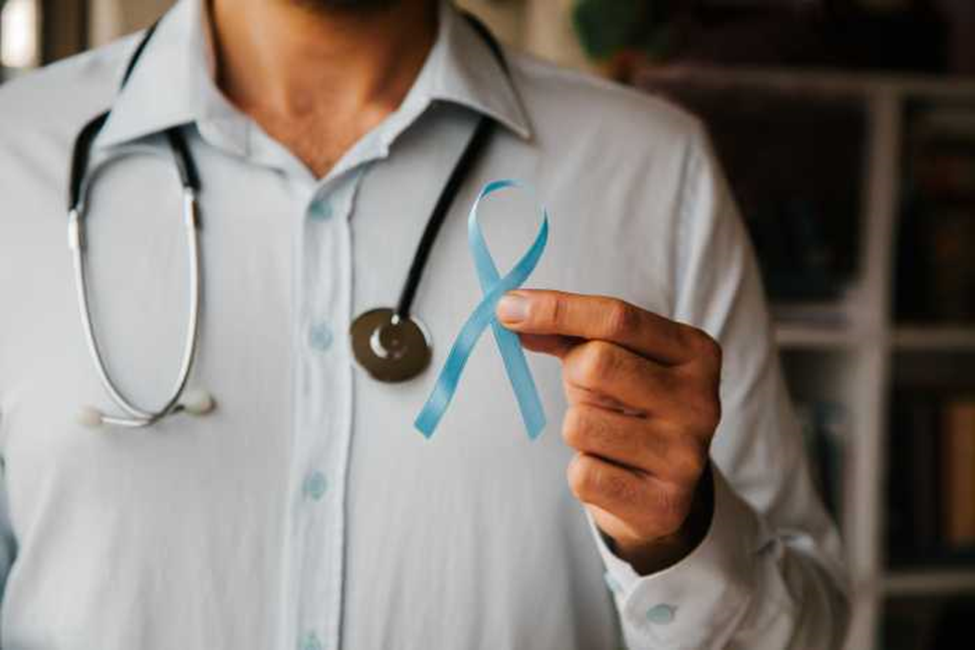 doctor with stethoscope holding ribbon for male prostate health