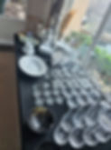 Glassware and dishes organized for estate liquidation.
