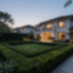 Estate liquidation property with landscaped garden at dusk
