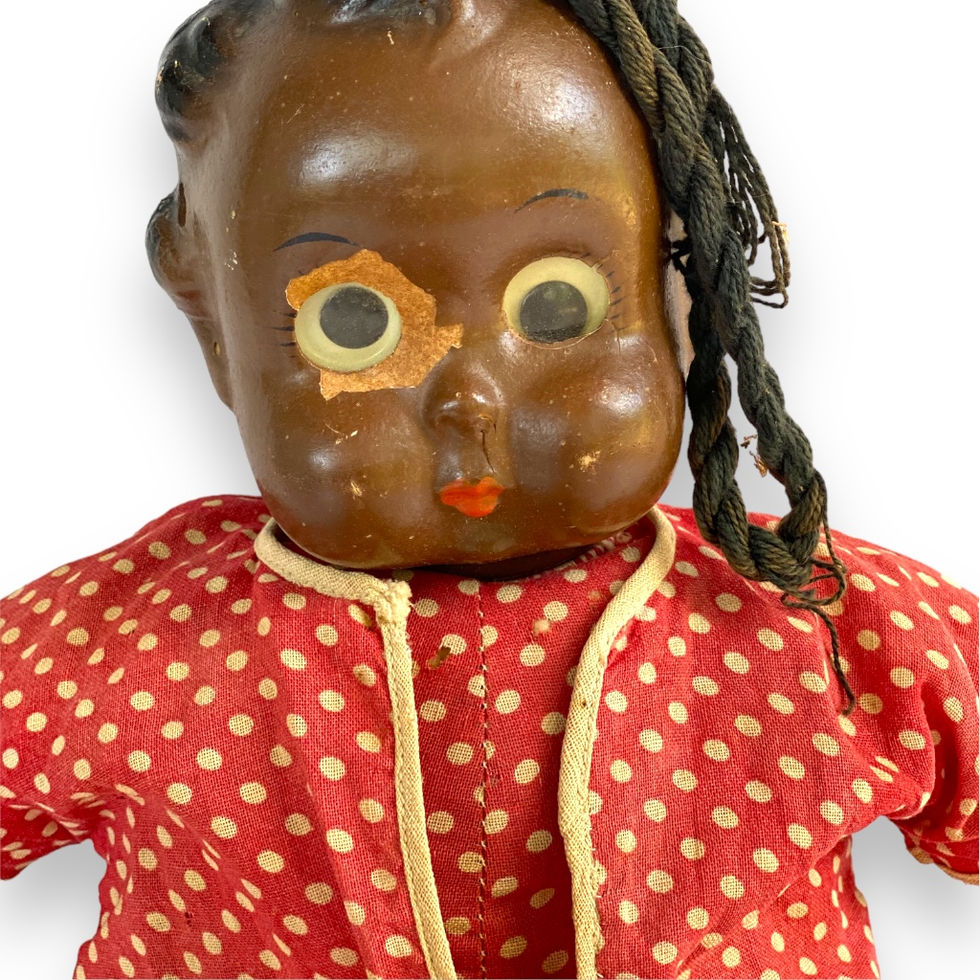 Close up view of Ralph Freundlich Black Americana Soft Body Goo Goo Topsy Doll
