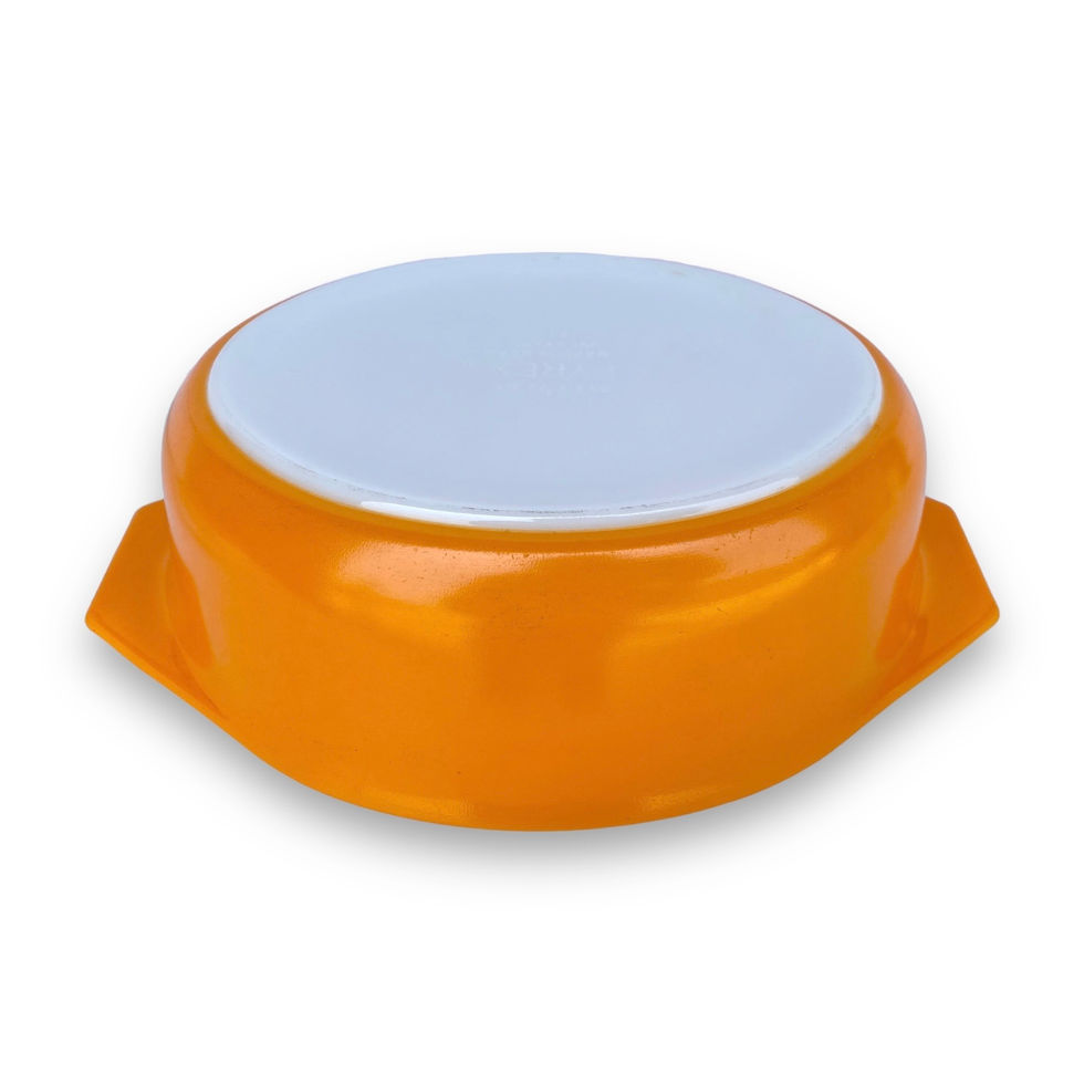 covered casserole dish with orange bowl and white lid with sunflower