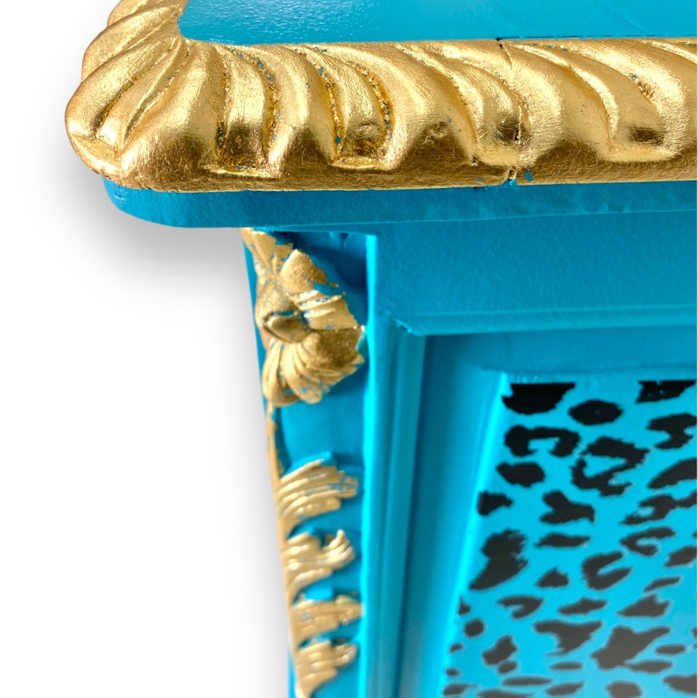 turquoise painted dresser with gold accents and pink floral patterns