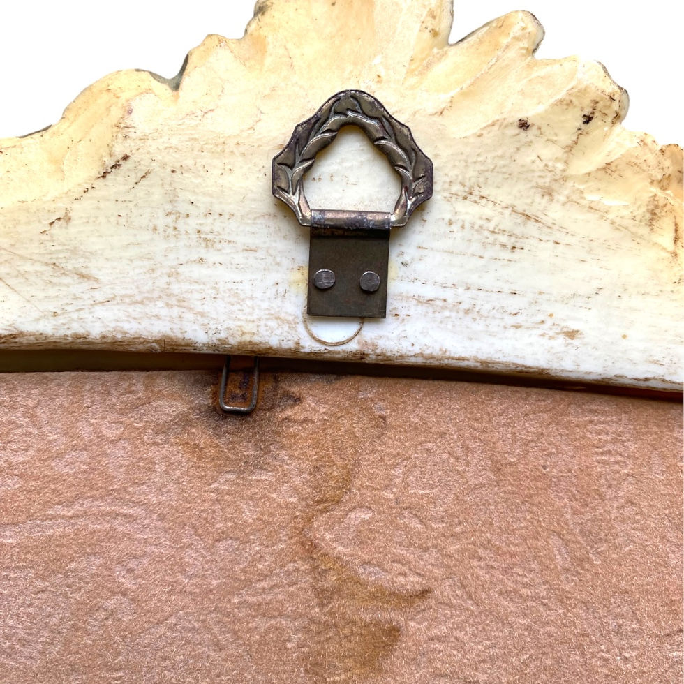close-up of ornate plaque hanger