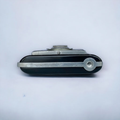 compact sleek black camera with silver accents and pull out lens