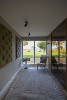 French doors looking out over a well-tended lawn