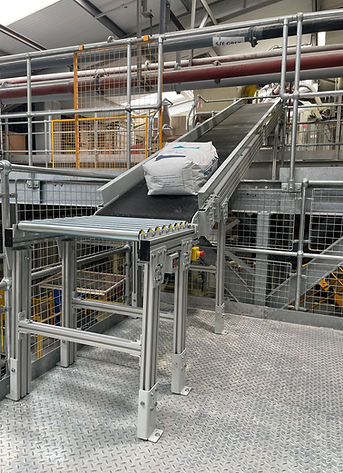 An inclined belt conveyor