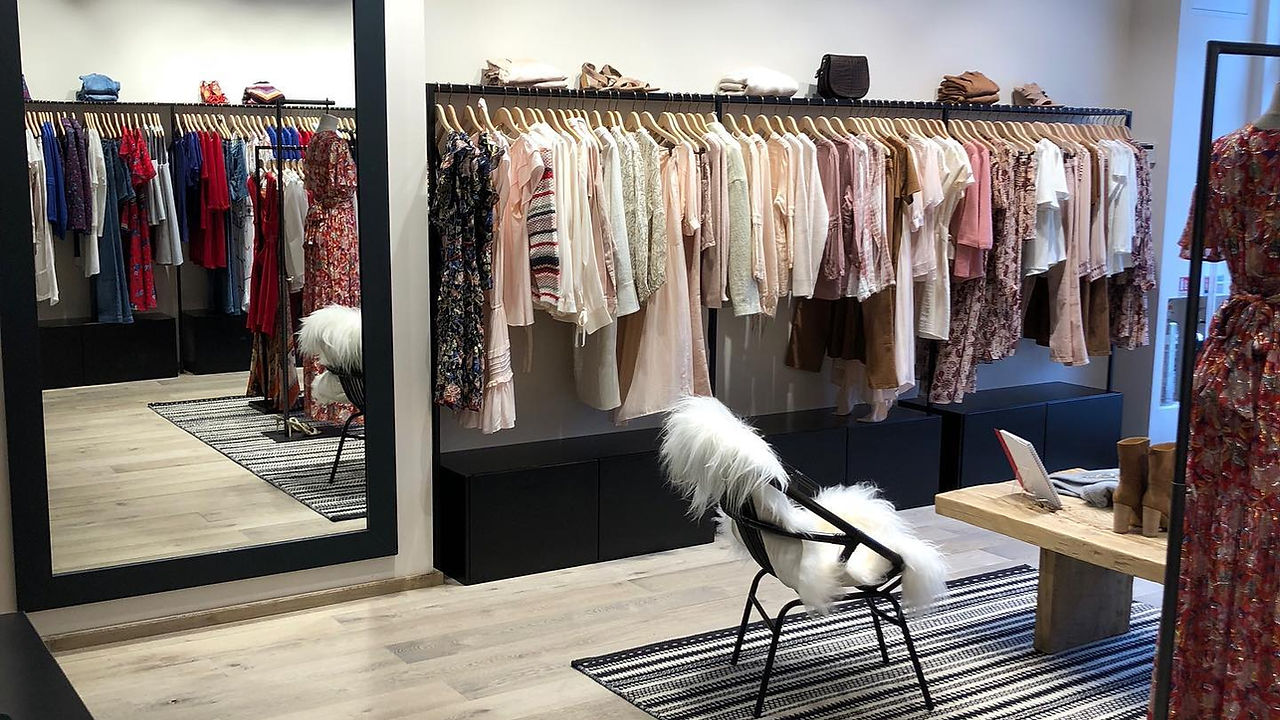 Clothes on a rail in a shop