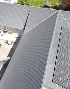 Grey tiled roof with solar panels