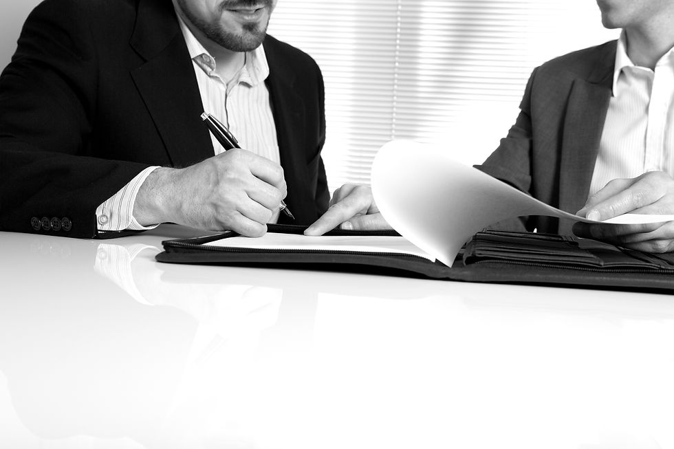 Two people looking at paperwork