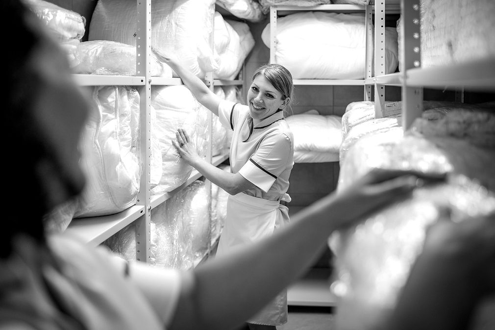 Woman organising linen closet