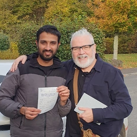 Student with driving instructor