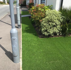 neat grassed front gardens with lamp posts