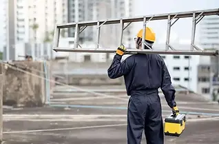 workman holding toolbox and ladder