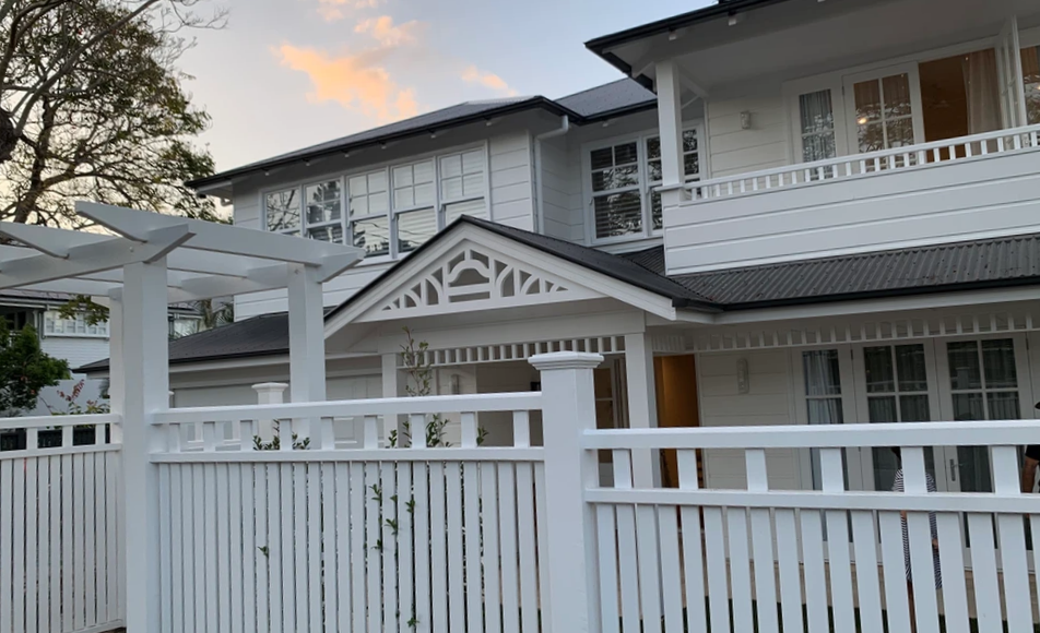 grey and white Queenslander home after the renovation with Brisbane Builder Craig Rynne Constructions