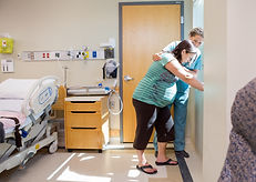 Mid adult female nurse comforting tensed