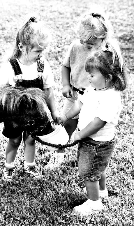 Girls Feeding Pony B&W