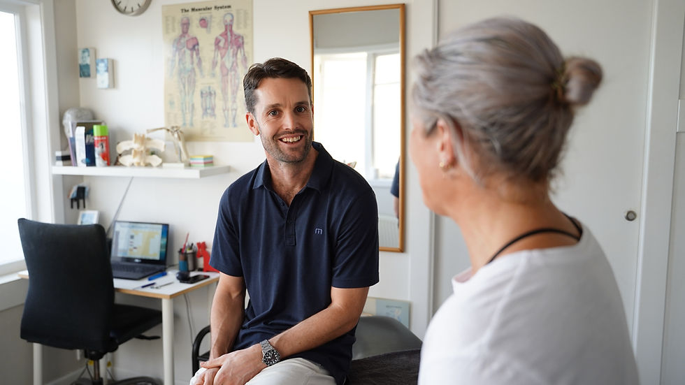Physiotherapist talking to client