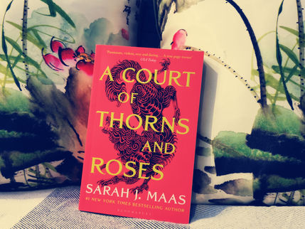 "A Court of Thorns and Roses" by Sarah J. Maas