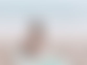 woman relaxing on tropical microfiber beach towel in Waikiki Hawaii