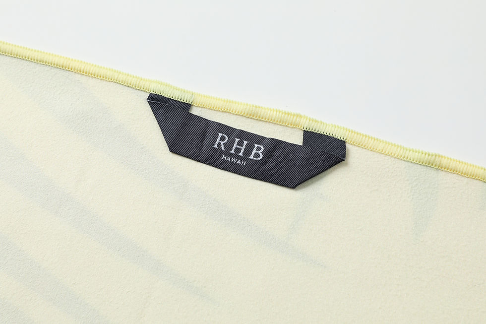 Thumbnail: Tropical Garden beach towel showing the hanging loop and RHB Hawaii logo tag.