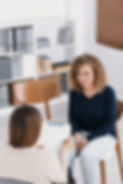 Woman with problem and supporting counselor during therapy session.jpg
