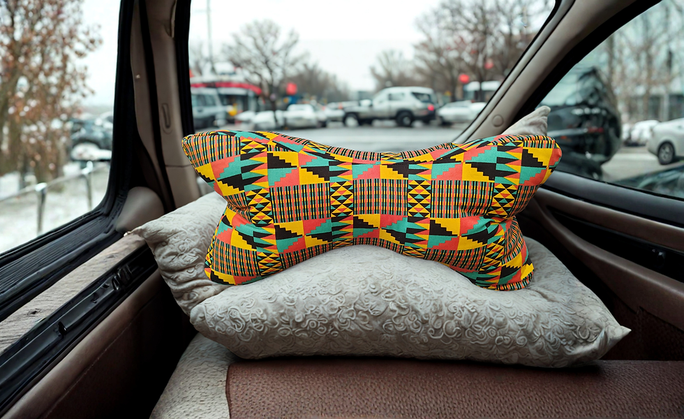 Made with two different multi- colored African fabrics neck bone shaped pillow