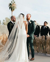 Bride and groom exchanging rings during a wedding ceremony in California