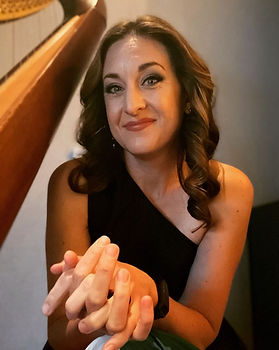 Close-up portrait of Lauren Sharkey, Northern California harpist, with her concert harp. Combining classical artistry with modern warmth.