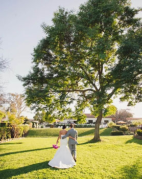 Wedding couple standing in the garden of The Inn at Rancho Santa Fe, Southern California wedding venue.