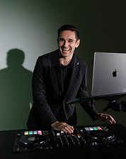 DJ Austo performing behind the decks at a wedding in Orange County, California.